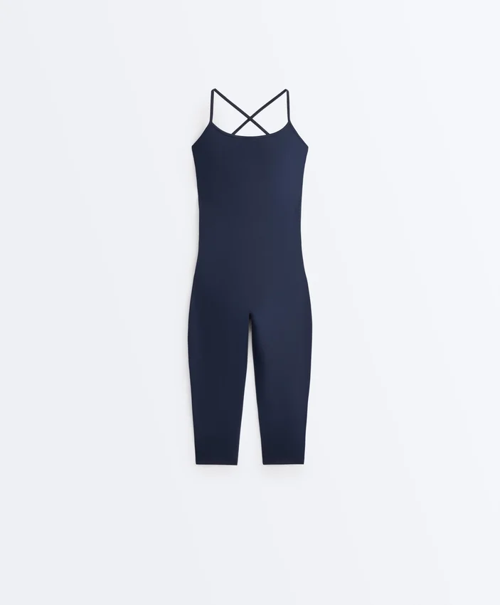 Kombinezon Comfortlux Capri z krzyżującymi się ramiączkami z tyłu Kombinezon Comfortlux Capri z krzyżującymi się ramiączkami z tyłu