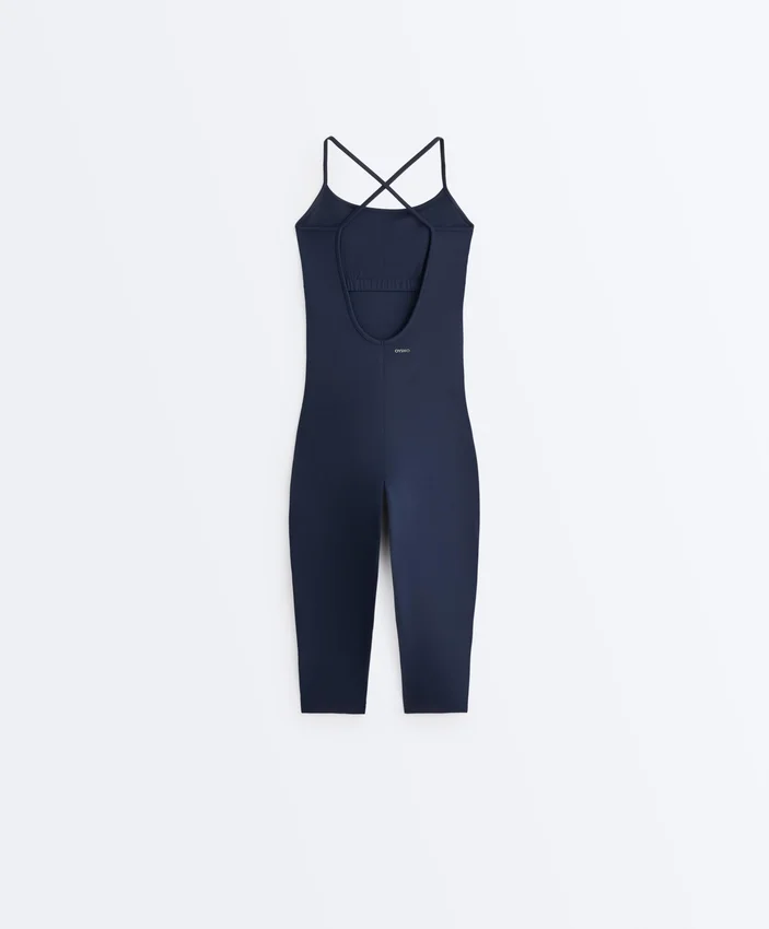 Kombinezon Comfortlux Capri z krzyżującymi się ramiączkami z tyłu Kombinezon Comfortlux Capri z krzyżującymi się ramiączkami z tyłu