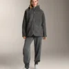 Kurtka oversize z imitacji kożucha z kapturem wyściełanym sztucznym futrem Kurtka oversize z imitacji kożucha z kapturem wyściełanym sztucznym futrem