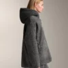 Kurtka oversize z imitacji kożucha z kapturem wyściełanym sztucznym futrem Kurtka oversize z imitacji kożucha z kapturem wyściełanym sztucznym futrem