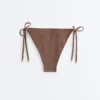 Majtki bikini o średnim stopniu zakrycia z wiązaniem i drobnym nadrukiem w kropki